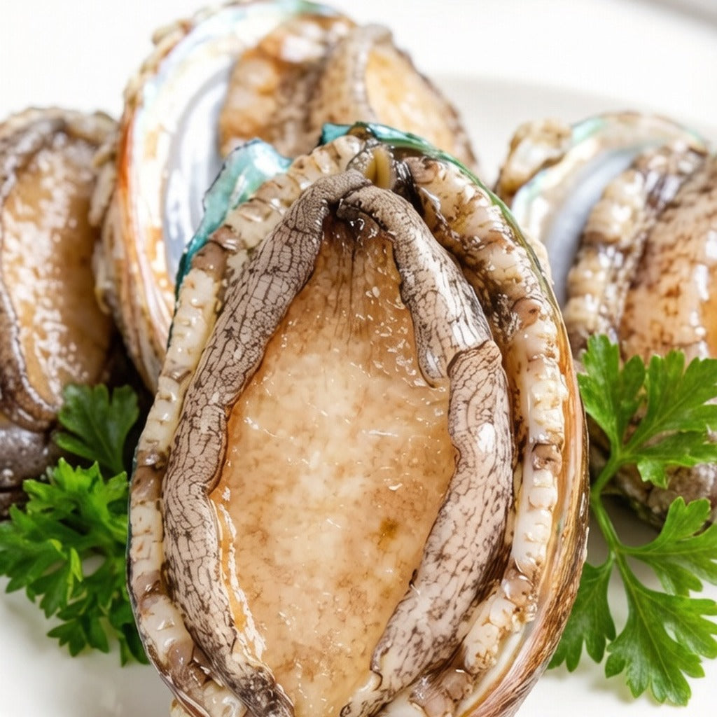 Whole abalone on a plate garnished with parsley